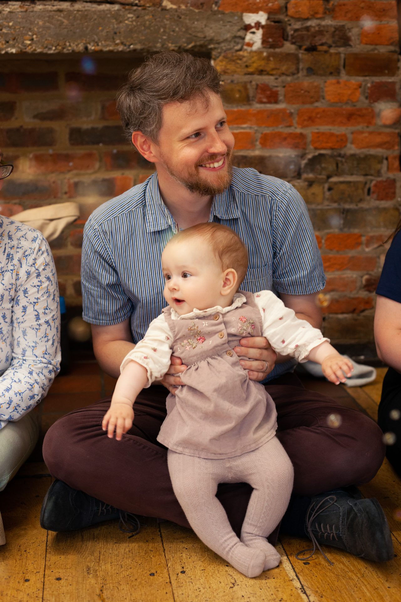 Dad holding baby at Mini Mozart Music Class for Babies in Hampstead