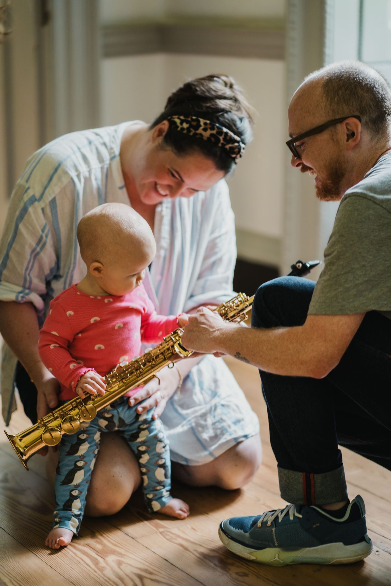 Mum and child exploring the saxophone at a Mini Mozart Music Class for babies and toddlers